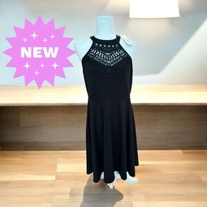 NWT black halter fit and flare dress with crochet neck details. XL